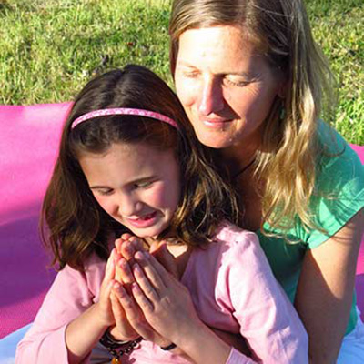 Suzanna Thell teaching a child Dru Yoga