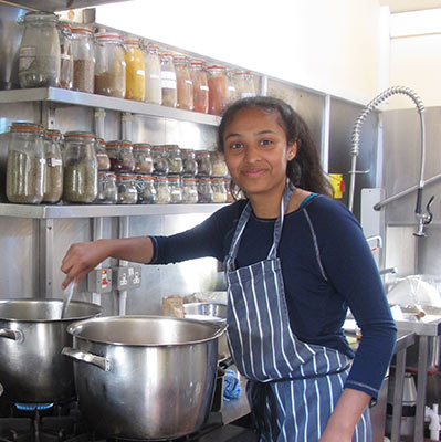 Volunteer cooking at the Dru centre