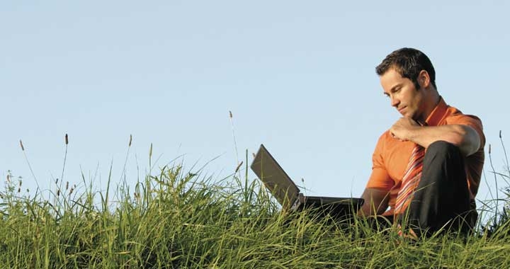 Dru worklife balance - man outside with laptop