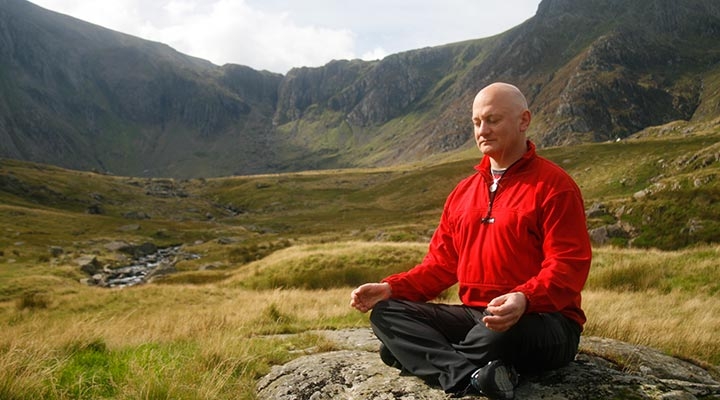 Chris Barrington meditating in nature